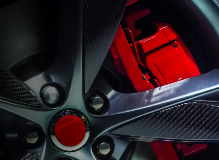 car wheel with a red break caliper