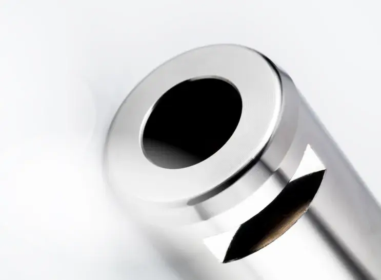 Closeup of a part treated with Electroless Nickel on a white background