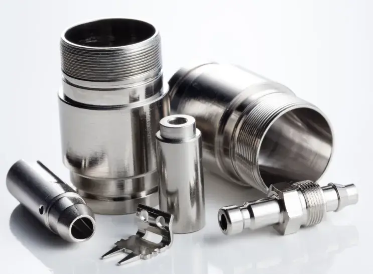 A group of electroless nickel coated connectors on white background
