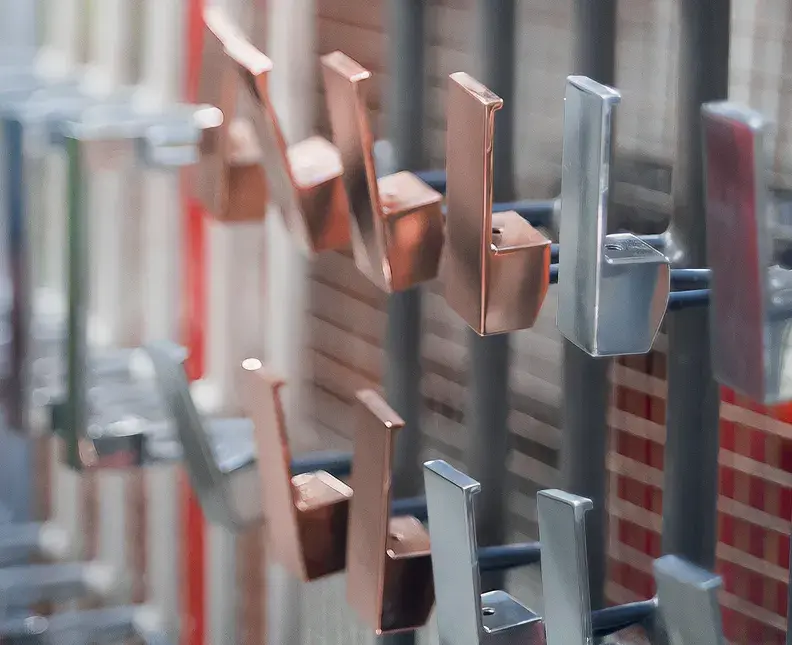 parts treated with copper on rack