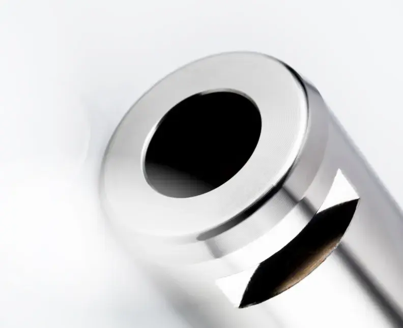 Closeup of a part treated with Electroless Nickel on a white background