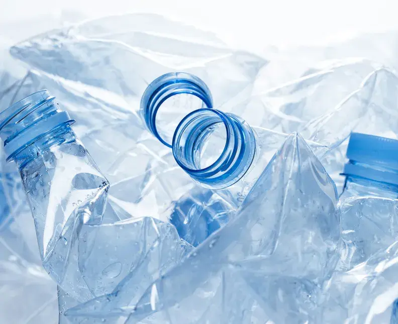 crushed clear blue plastic bottles