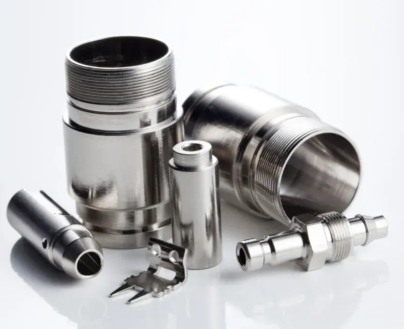A group of electroless nickel coated connectors on white background