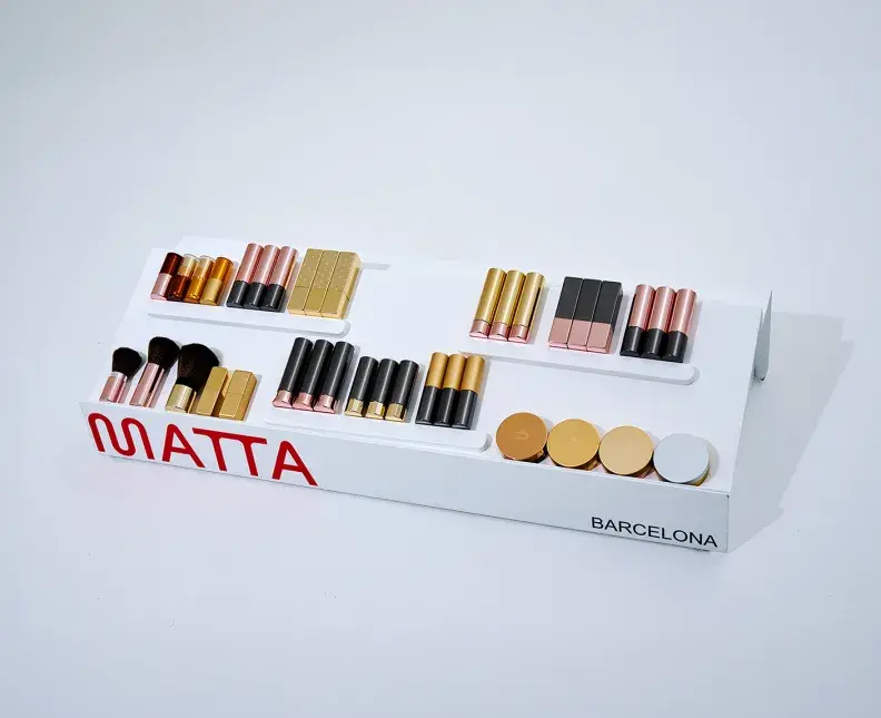 Selection of cosmetics packaging in shades of pink and gold