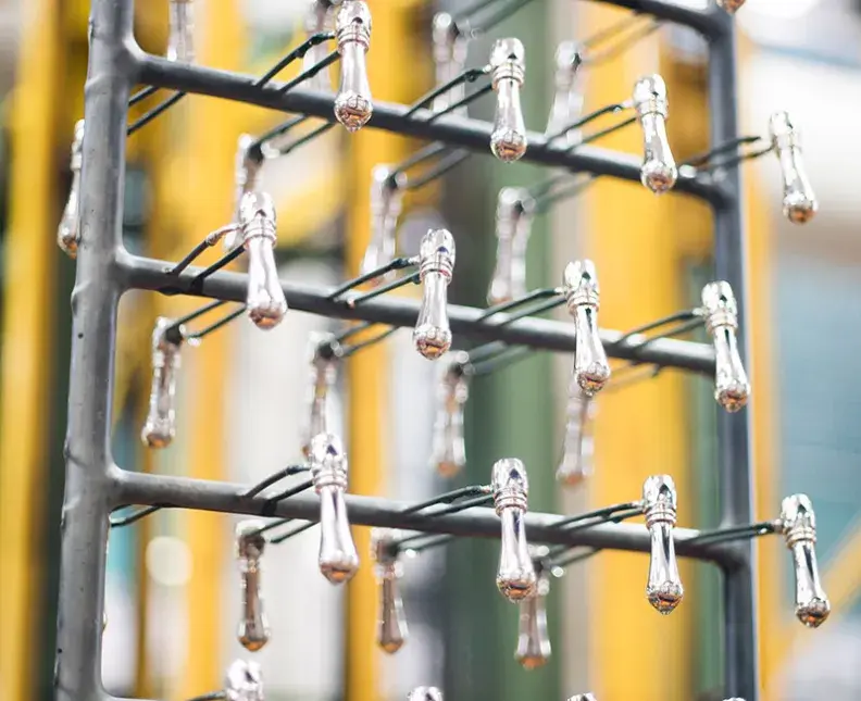 metalized plastic parts on a rack