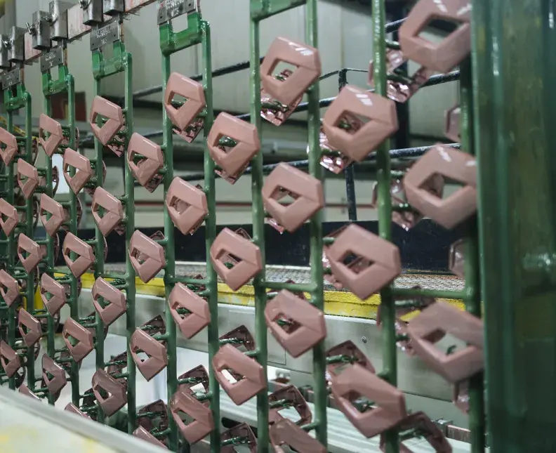 Plastic parts on rack in a plating facility