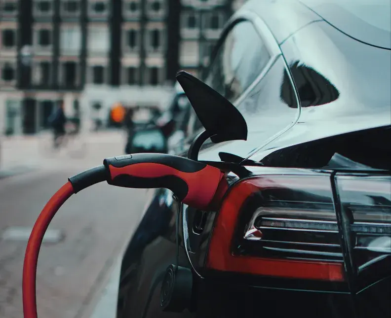 an electric vehicle charging in a town square