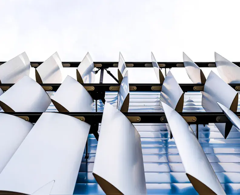 Wide-angle view of a modern building facade featuring aluminum curtain wall panels